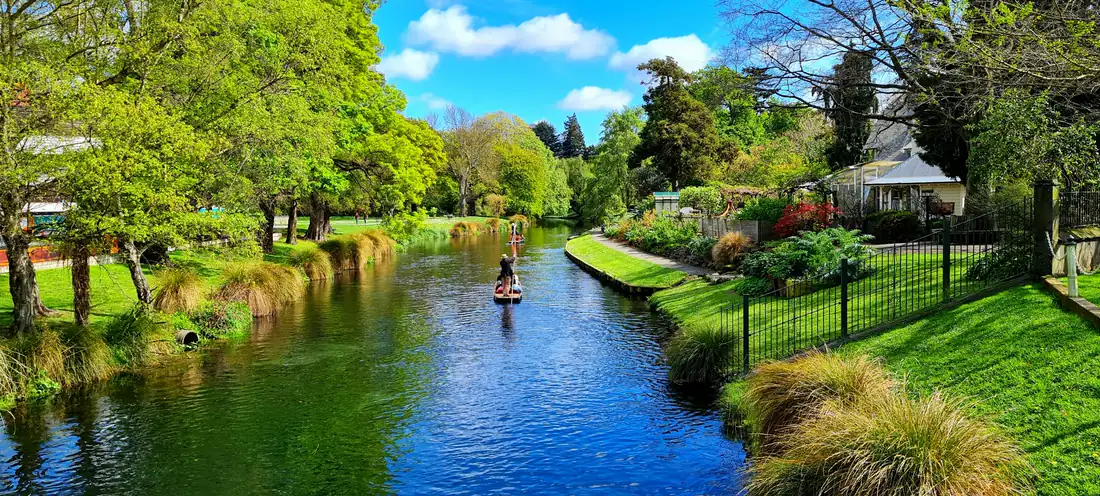 The Avon River winding through a green park in Christchurch